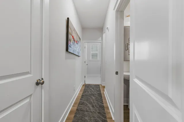 a view of a hallway with a white walls