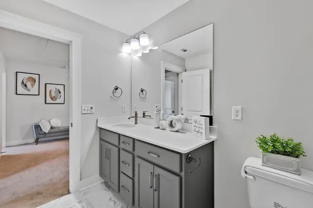a bathroom with a sink double vanity and a mirror