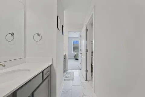 a bathroom with a shower and a sink