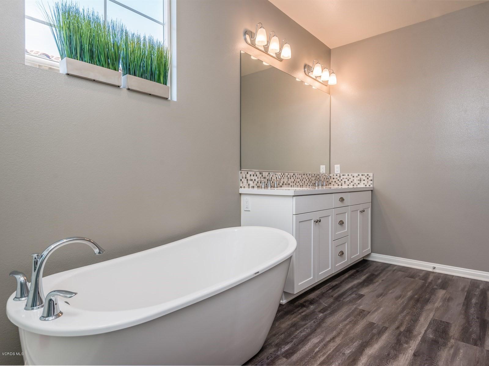287 Stagetrail Road Camarillo, CA 93010 - Photo 18 of 30 a bathroom with a sink a toilet and mirror