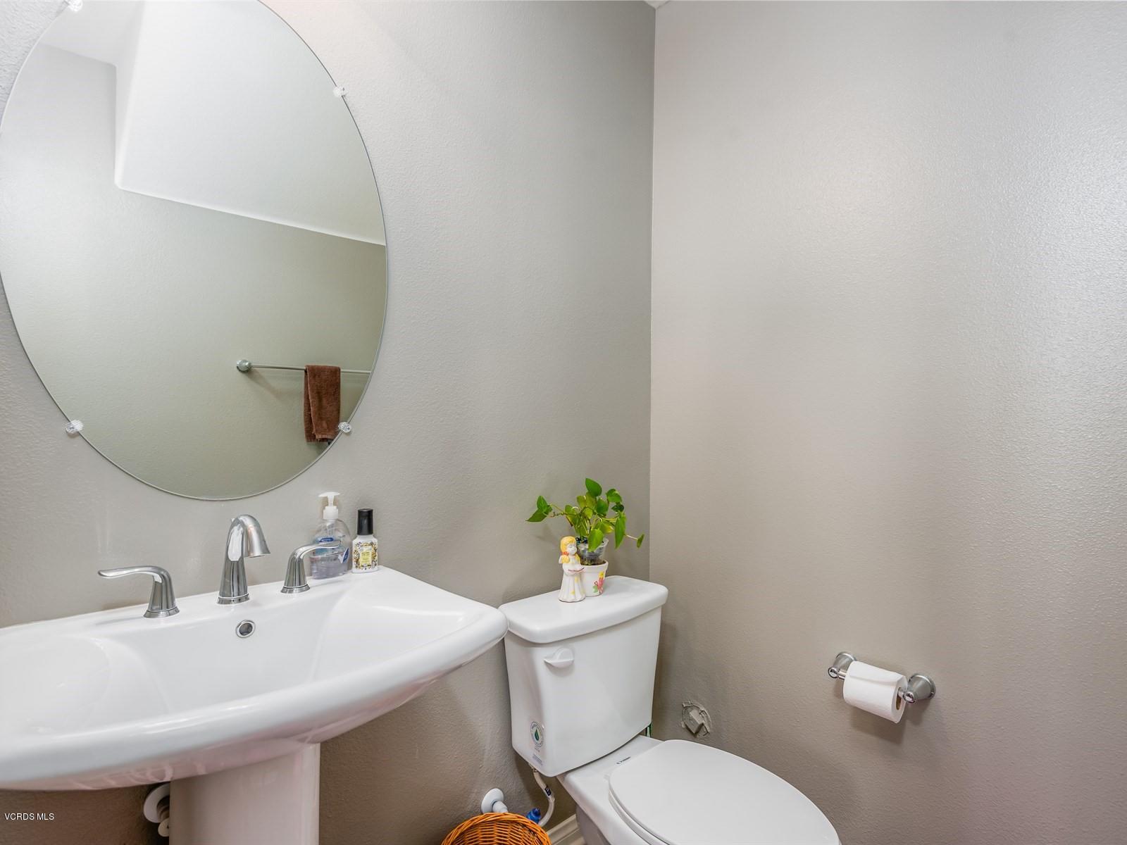 287 Stagetrail Road Camarillo, CA 93010 - Photo 25 of 30 a bathroom with a sink mirror and toilet