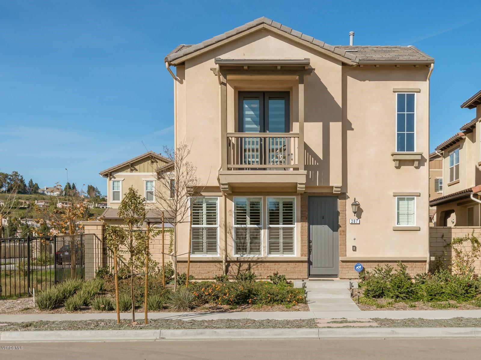 287 Stagetrail Road Camarillo, CA 93010 - Photo 5 of 30 a front view of a residential apartment building with a yard