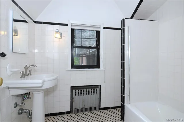 a bathroom with a sink and a bathtub