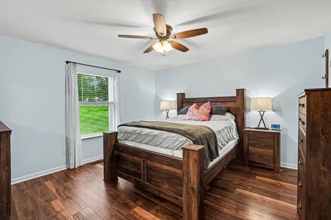 a bedroom with a large bed and a window
