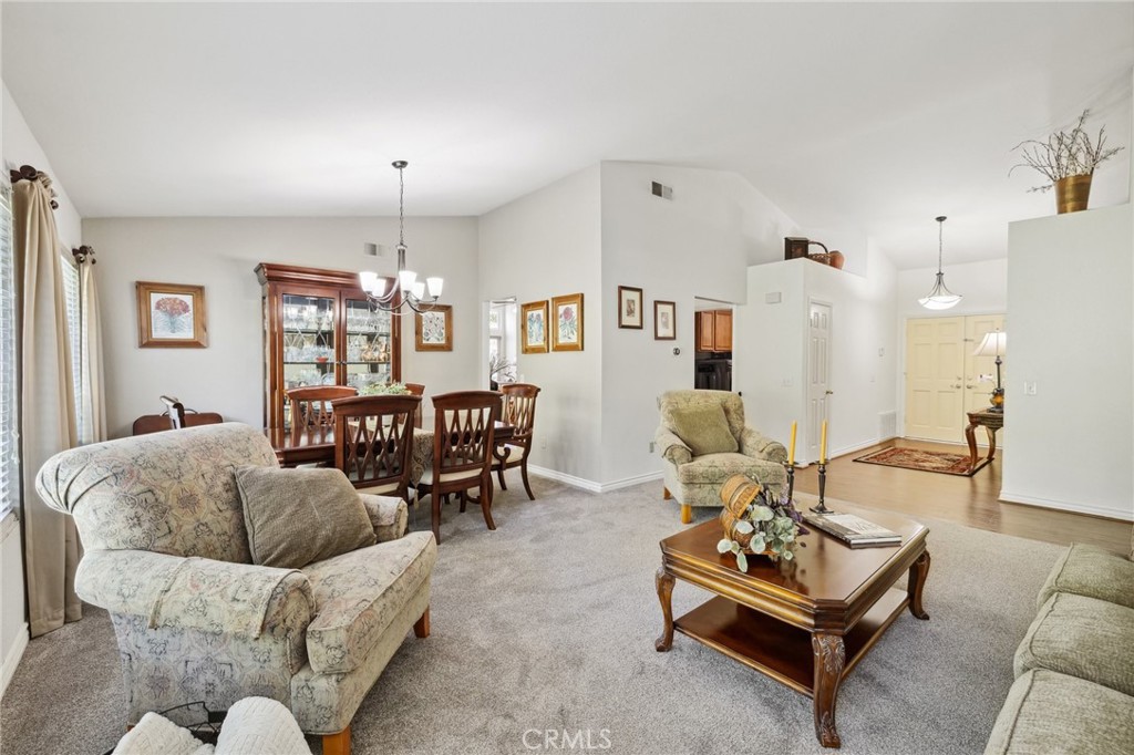 6752 Laurel Brook Drive Riverside, CA 92506 - Photo 12 of 53 a living room with furniture and a chandelier