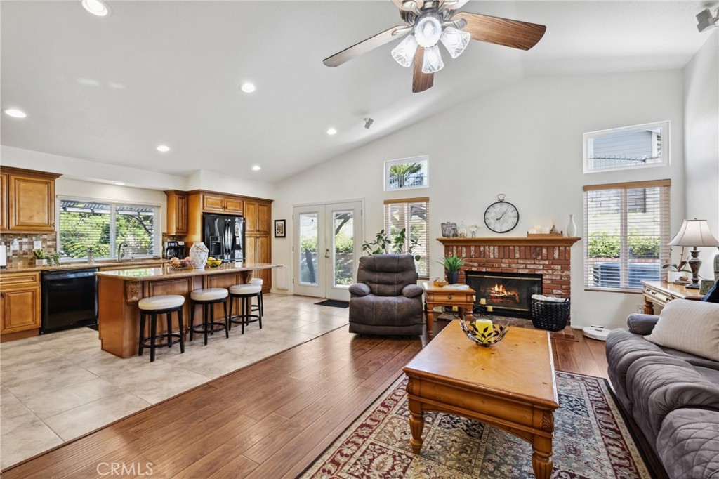 6752 Laurel Brook Drive Riverside, CA 92506 - Photo 14 of 53 a living room with furniture a dining table and a large window