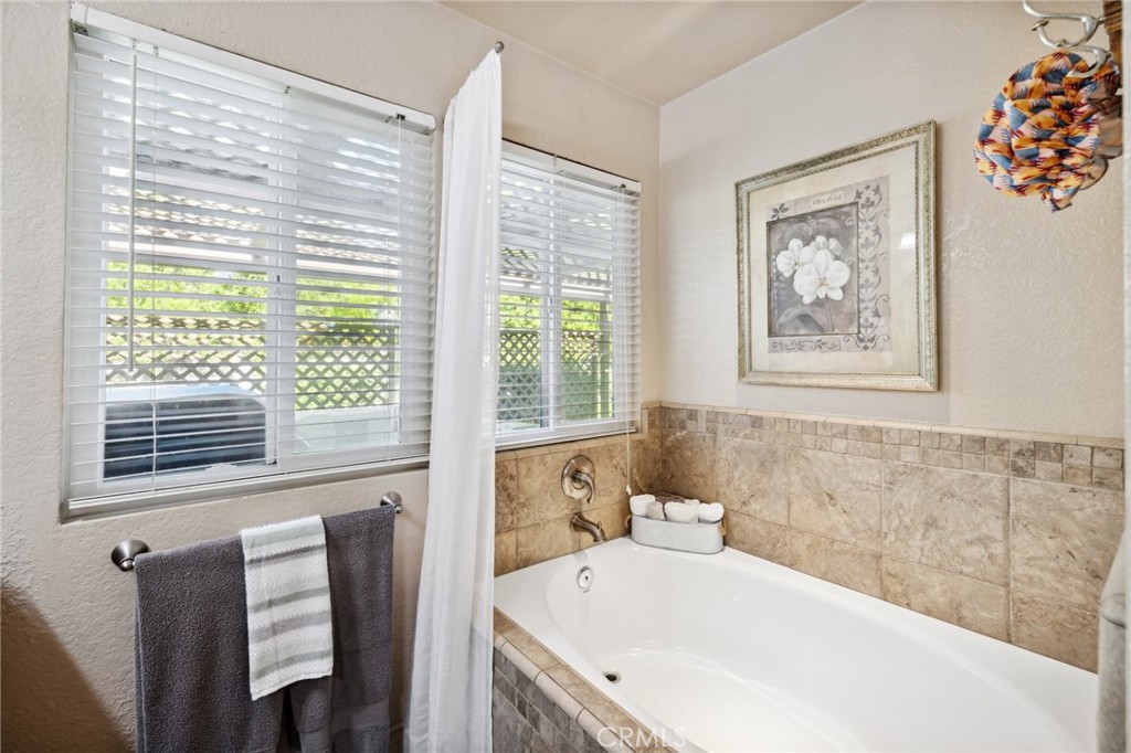 6752 Laurel Brook Drive Riverside, CA 92506 - Photo 23 of 53 a bathroom with a bathtub and a window