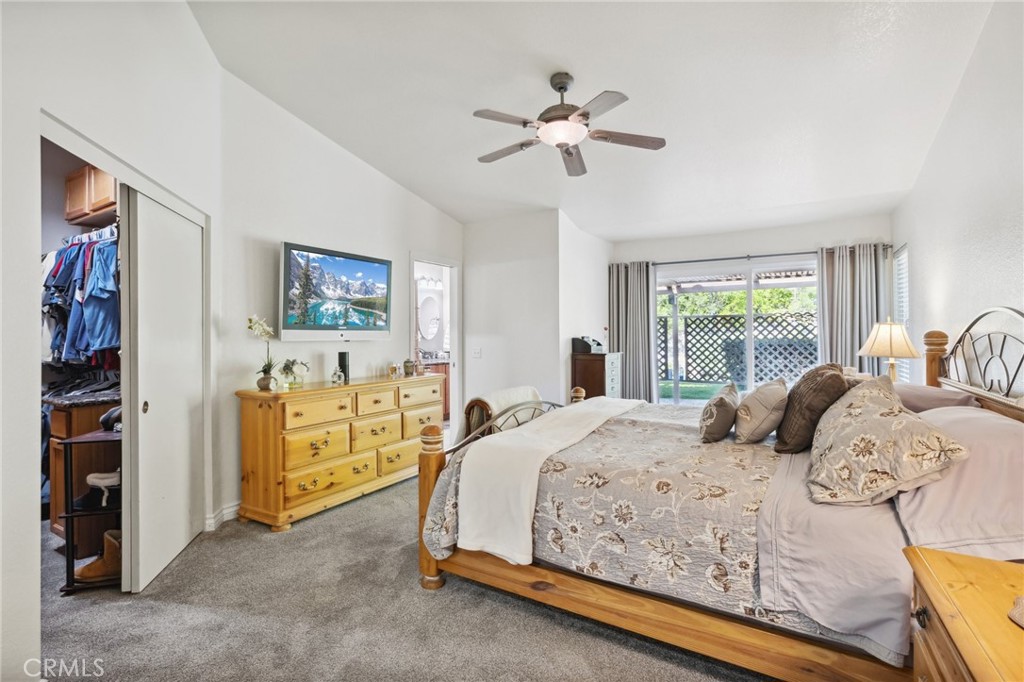 6752 Laurel Brook Drive Riverside, CA 92506 - Photo 28 of 53 a bedroom with a bed and a chandelier