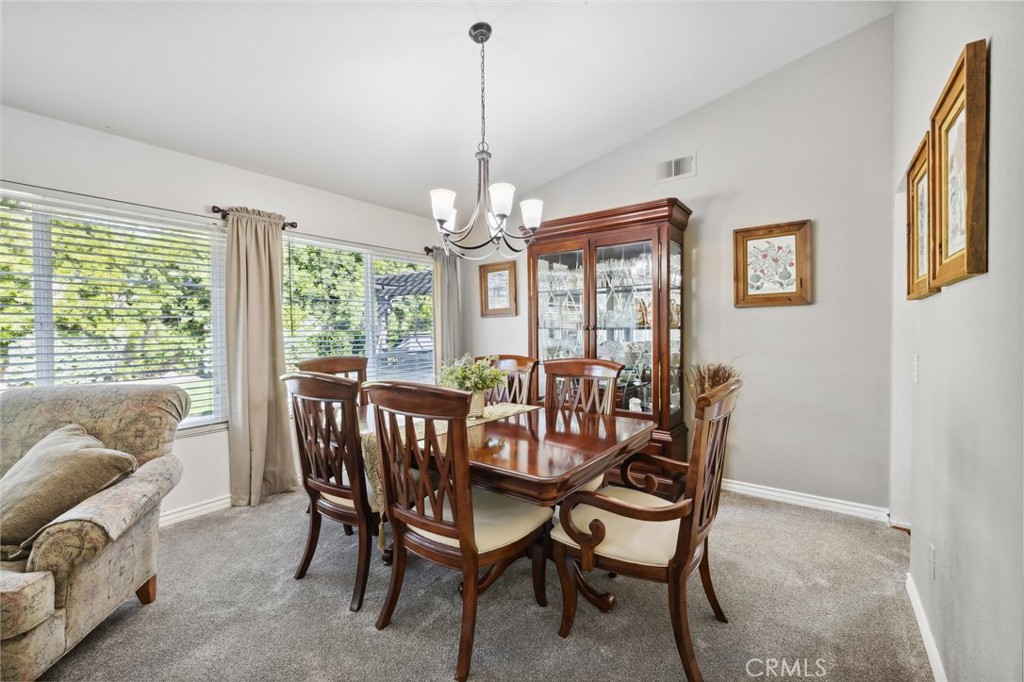 6752 Laurel Brook Drive Riverside, CA 92506 - Photo 9 of 53 a view of a dining room with furniture window and outside view