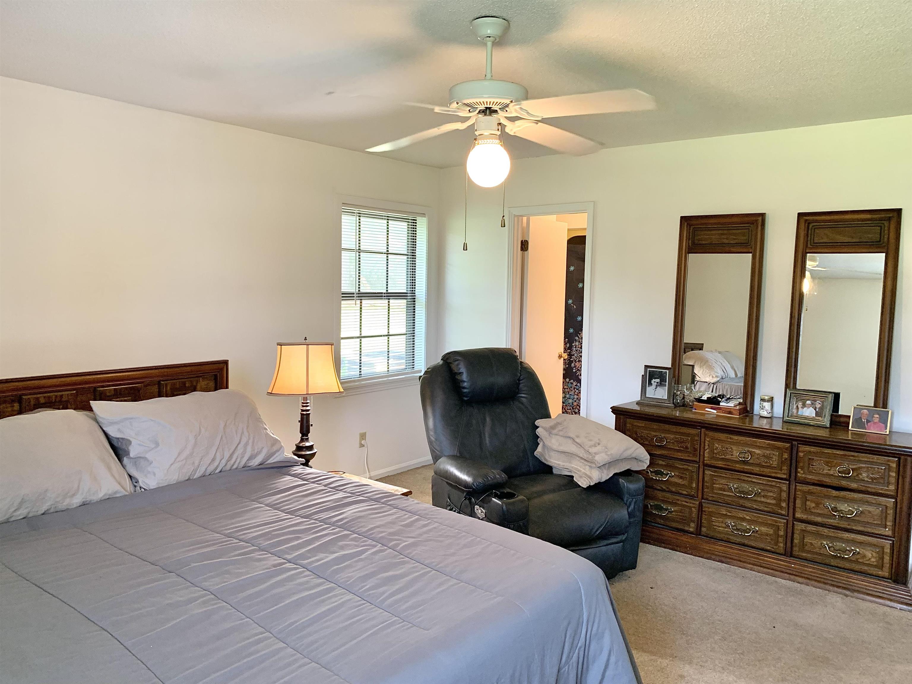 111 Robin Court Middleton, TN 38052 - Photo 13 of 23 a bedroom with a bed and furniture