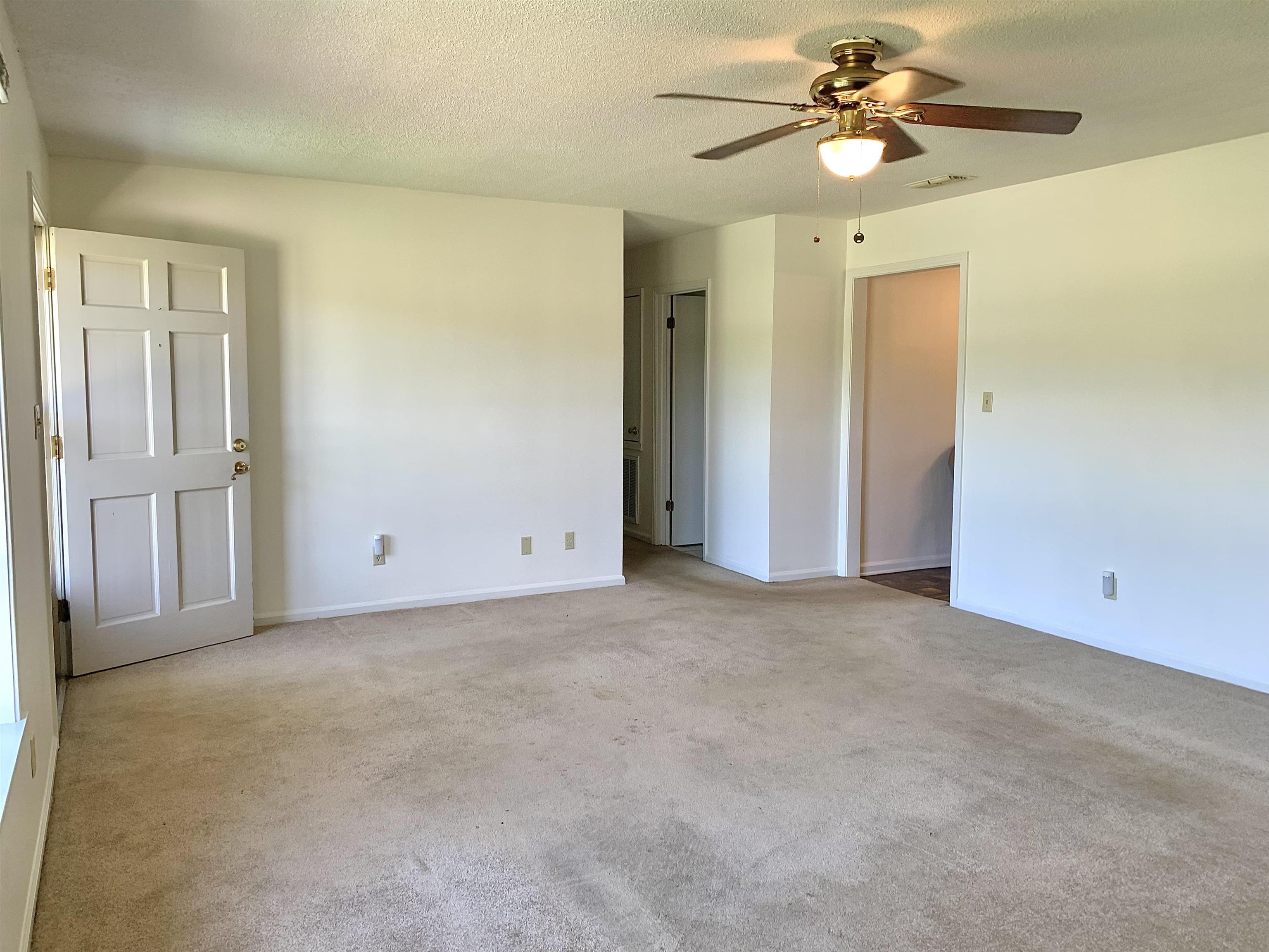 111 Robin Court Middleton, TN 38052 - Photo 3 of 23 a view of a big room with chandelier fan and closet area