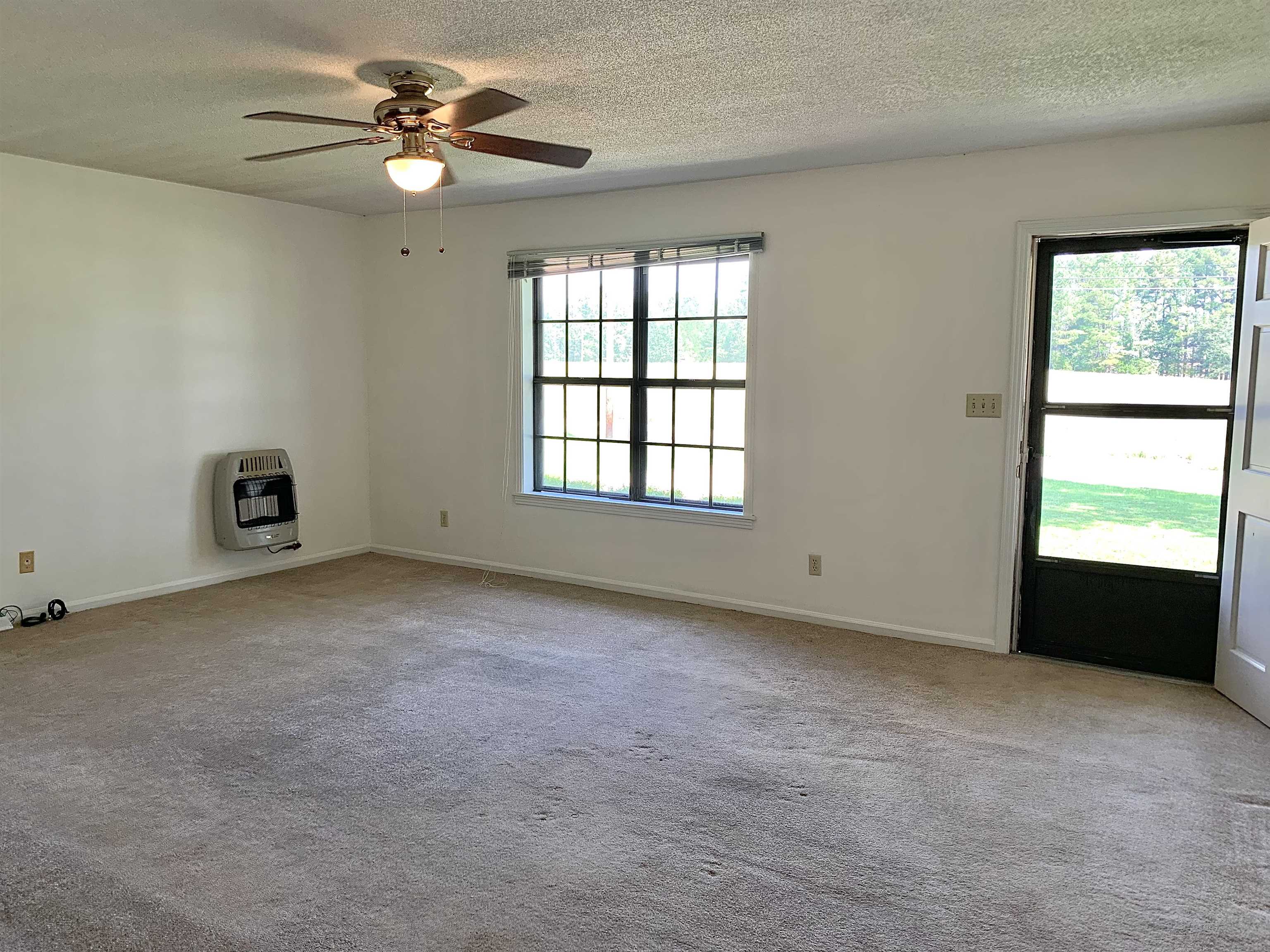 111 Robin Court Middleton, TN 38052 - Photo 4 of 23 a view of an empty room with a window