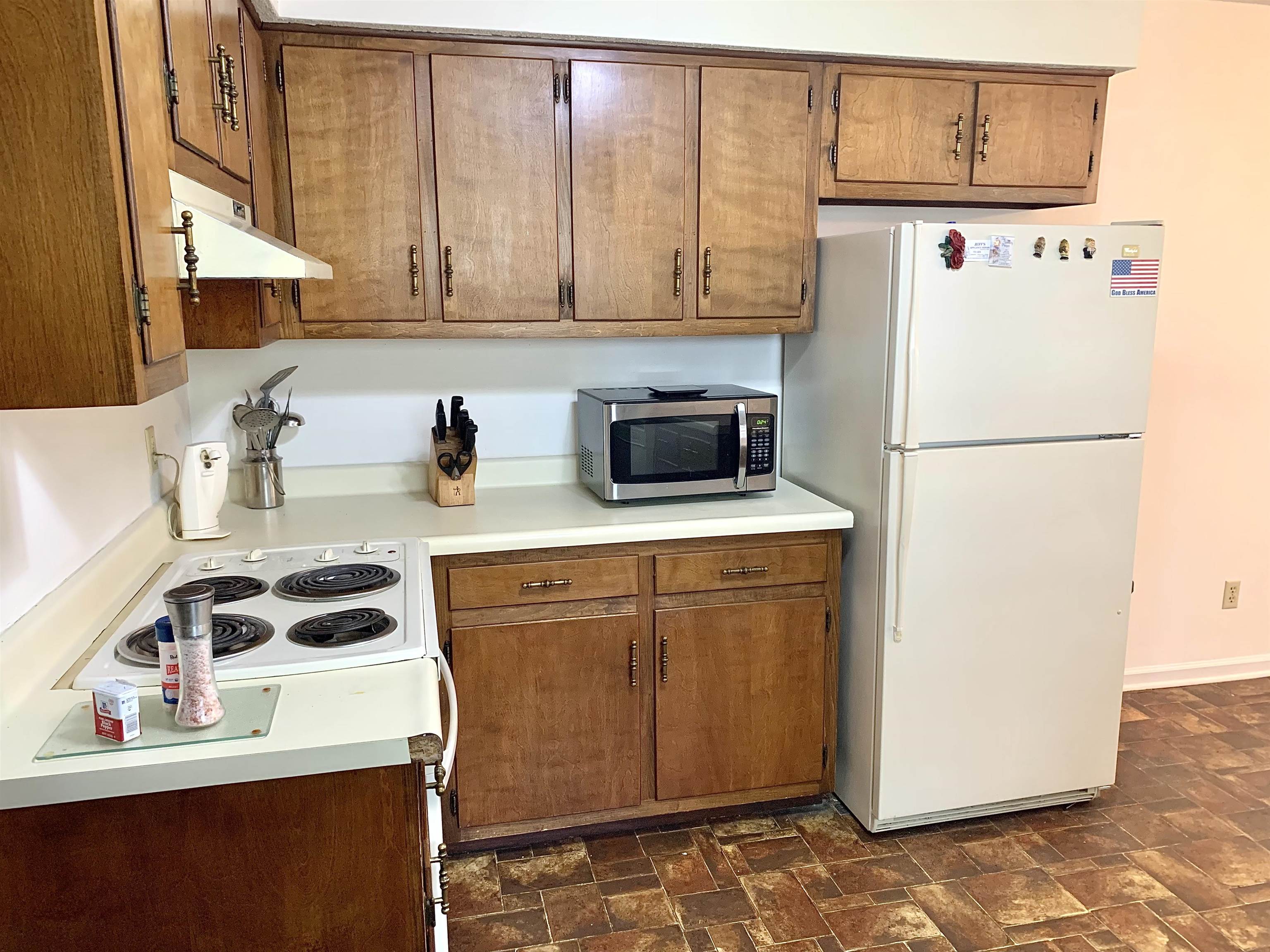 111 Robin Court Middleton, TN 38052 - Photo 5 of 23 a kitchen with a refrigerator and cabinets