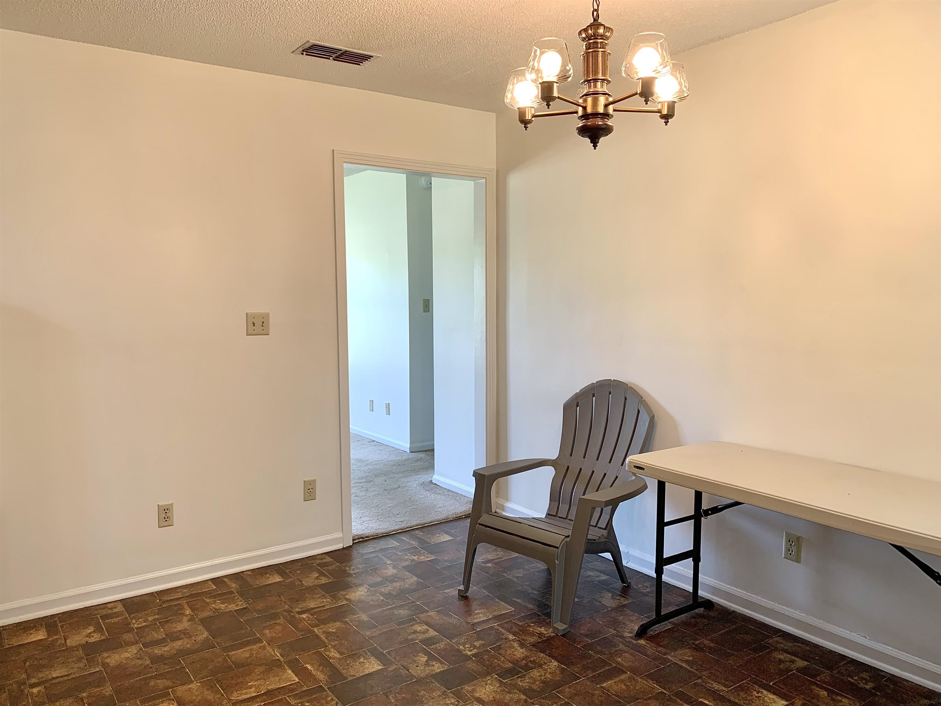 111 Robin Court Middleton, TN 38052 - Photo 8 of 23 a dining room with a table and chairs