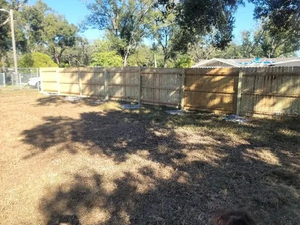 a view of a backyard of the house