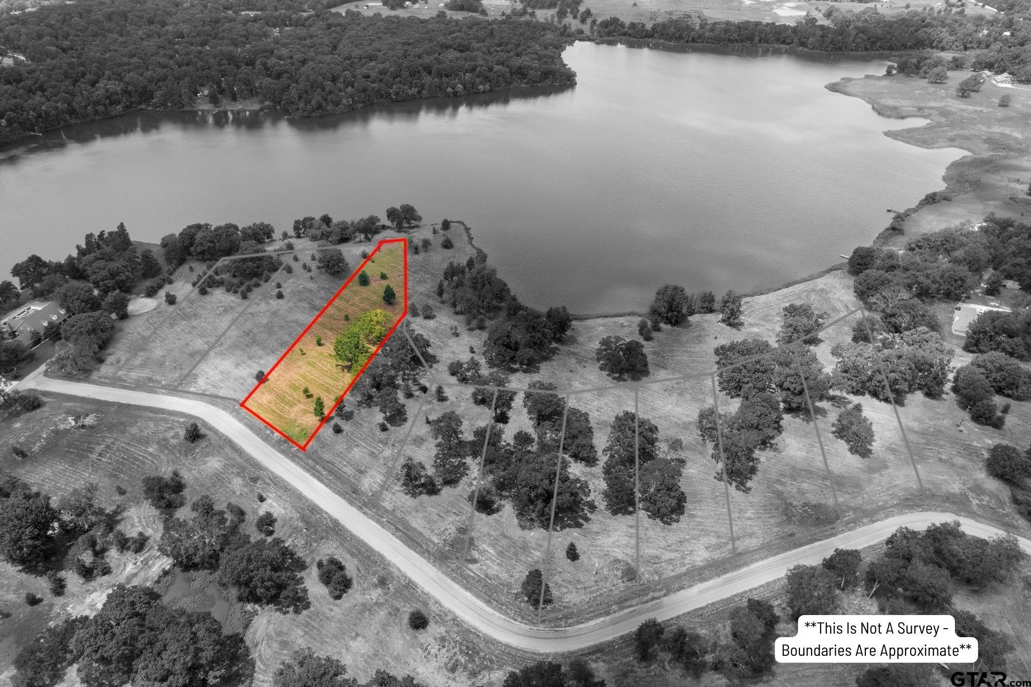 Tbd Lot 9 Tbd Way Mount Pleasant, TX 75455 - Photo 4 of 13 a view of a lake from a balcony