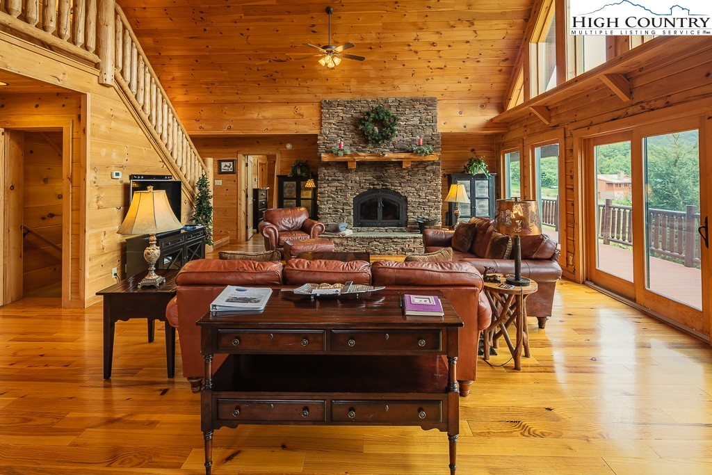 3320 Shawnee Road Banner Elk, NC 28604 - Photo 5 of 40 a living room with couches chairs and a fireplace