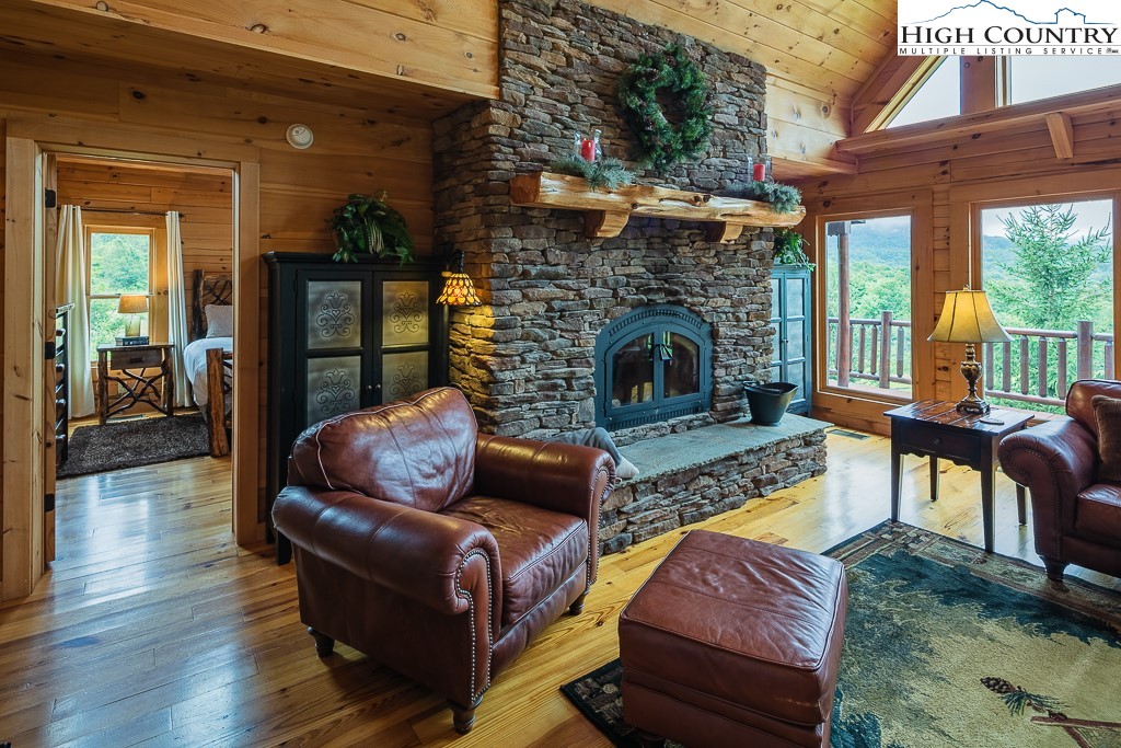 3320 Shawnee Road Banner Elk, NC 28604 - Photo 9 of 40 a outdoor living space with furniture and a fireplace