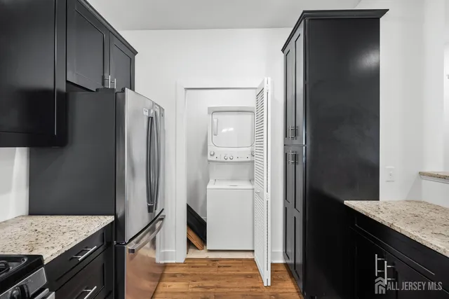 a kitchen with a refrigerator and a stove