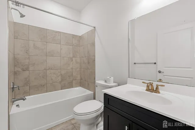 a bathroom with a sink double vanity and a mirror