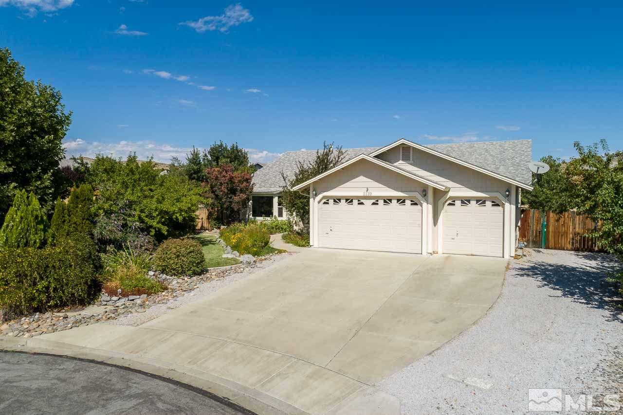 2139 Inca Dove Court Sparks, NV 89441 - Photo 1 of 25 a view of a white house with a yard and garage