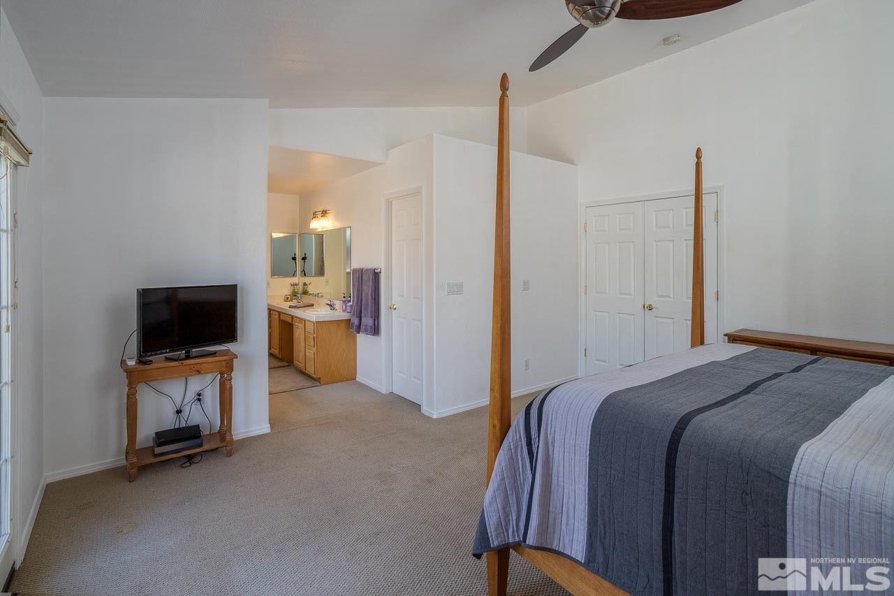 2139 Inca Dove Court Sparks, NV 89441 - Photo 11 of 25 a bedroom with a bed and a flat screen tv