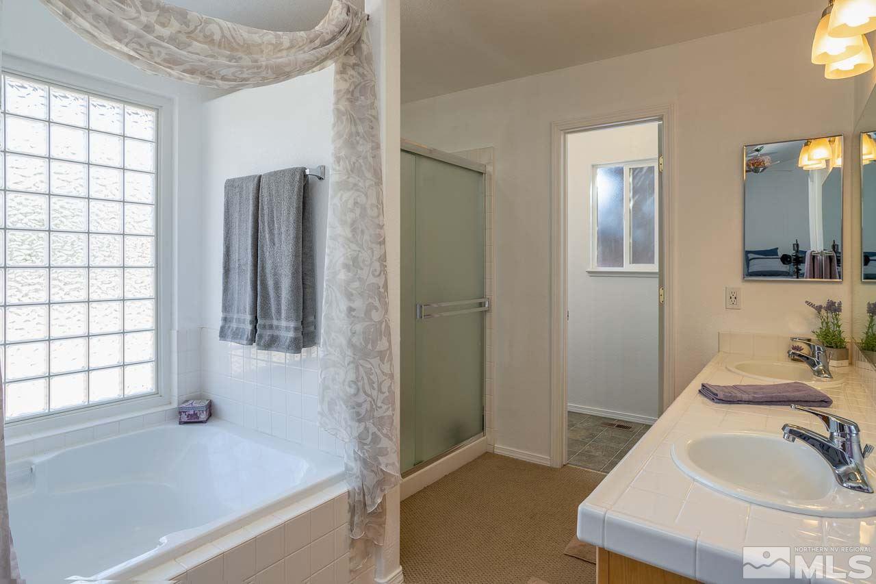 2139 Inca Dove Court Sparks, NV 89441 - Photo 12 of 25 a bathroom with a sink and a bathtub
