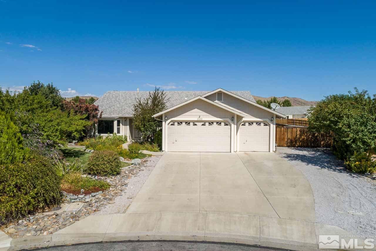 2139 Inca Dove Court Sparks, NV 89441 - Photo 20 of 25 a view of a large white house with a yard