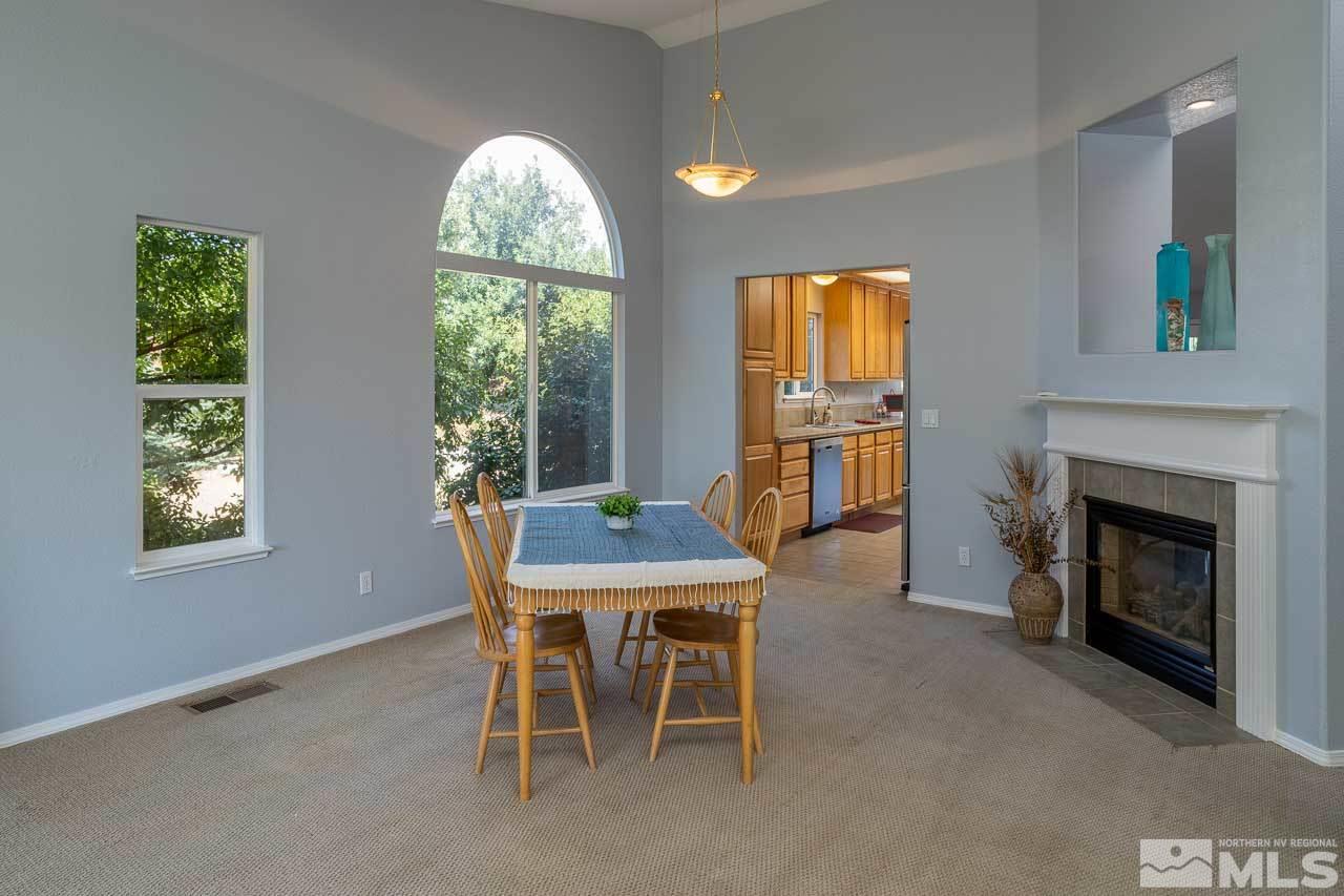 2139 Inca Dove Court Sparks, NV 89441 - Photo 3 of 25 a dining room with furniture window fireplace and wooden floor