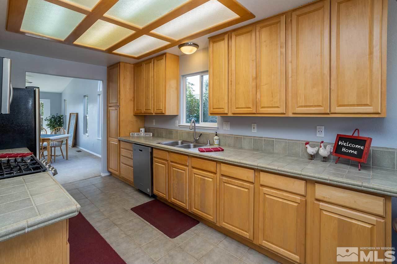 2139 Inca Dove Court Sparks, NV 89441 - Photo 6 of 25 a kitchen with sink cabinets and window