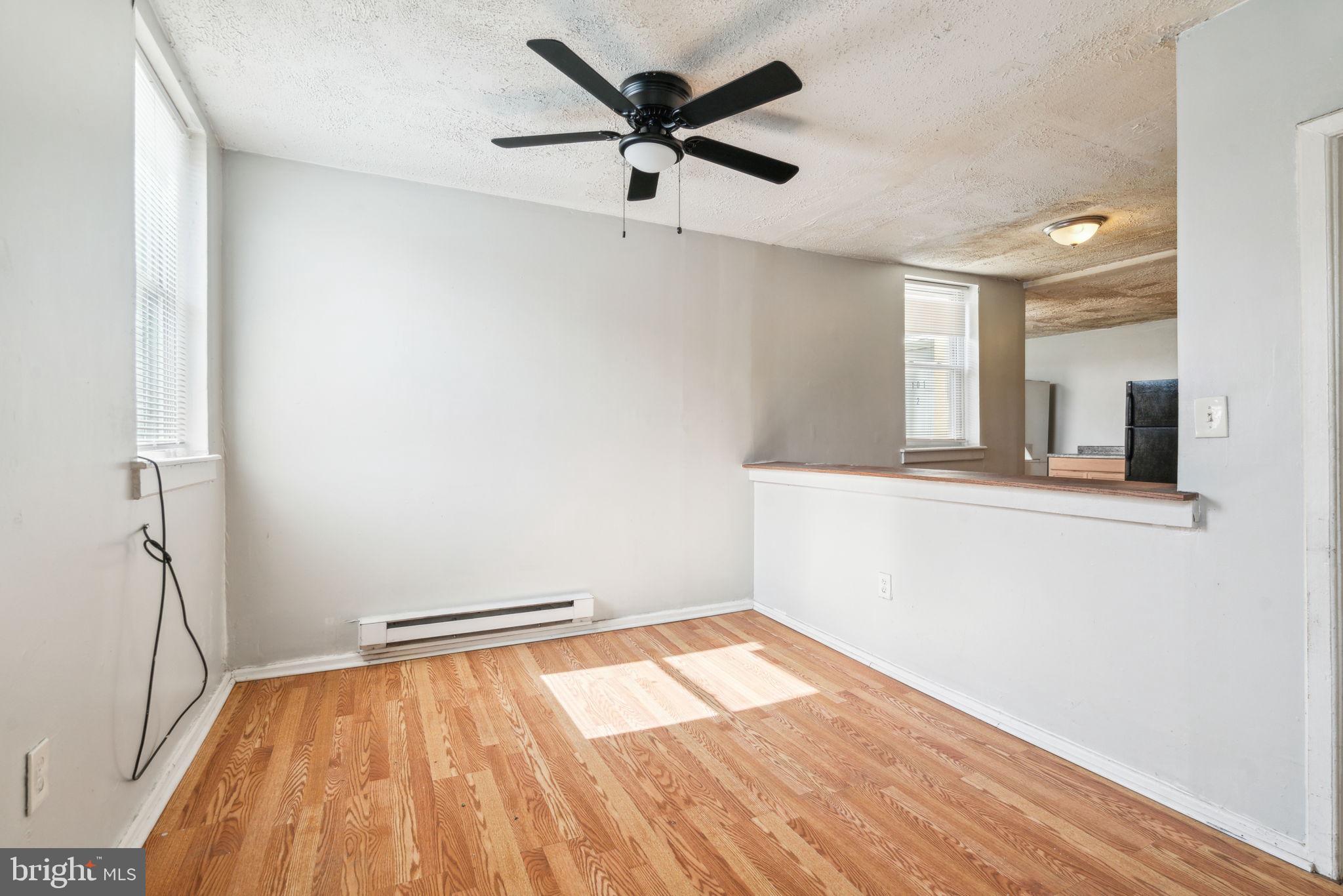 101 Pleasant Street Philadelphia, PA 19119 - Photo 13 of 43 wooden floor in an empty room with a window