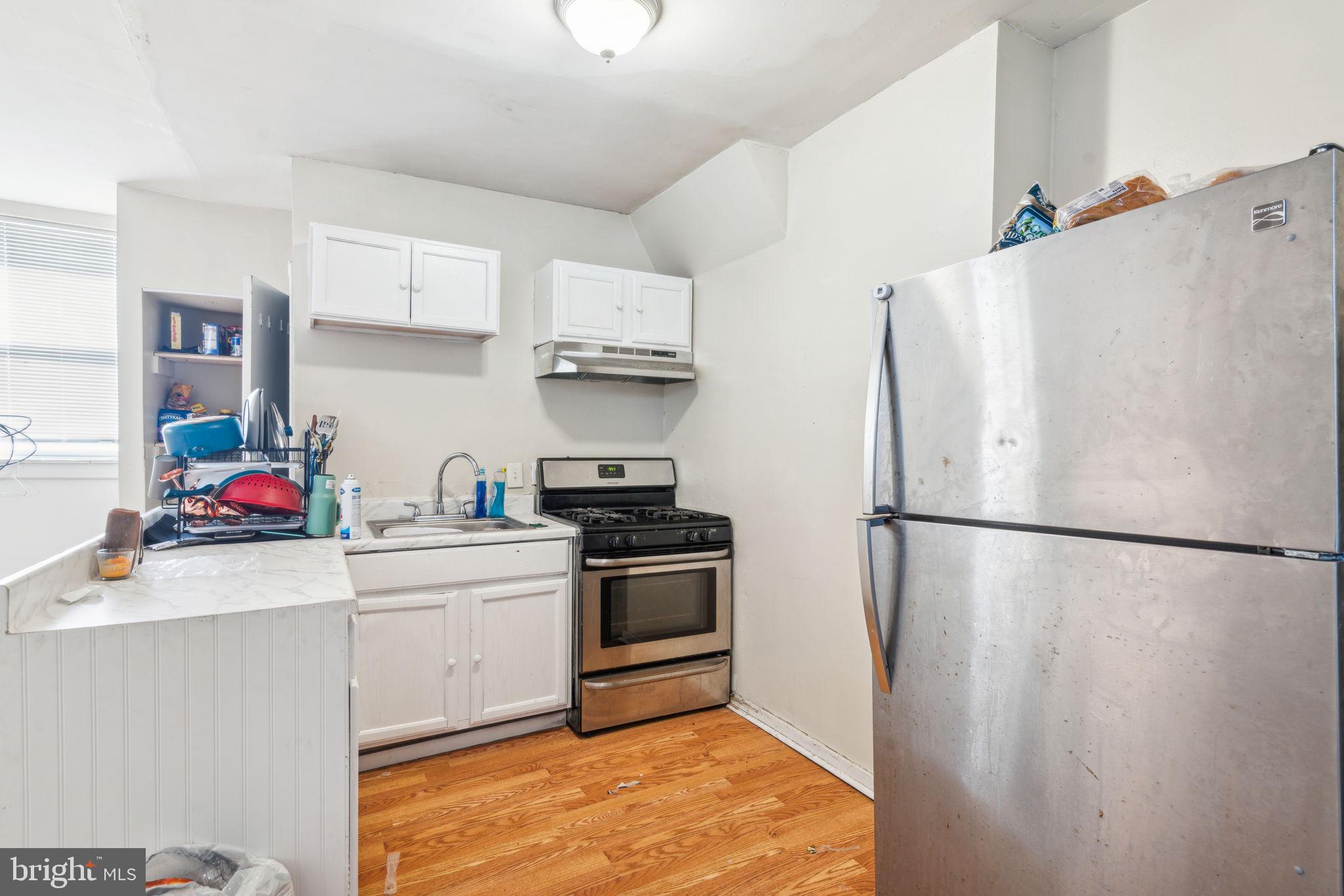 101 Pleasant Street Philadelphia, PA 19119 - Photo 31 of 43 a kitchen with stainless steel appliances a refrigerator sink and cabinets