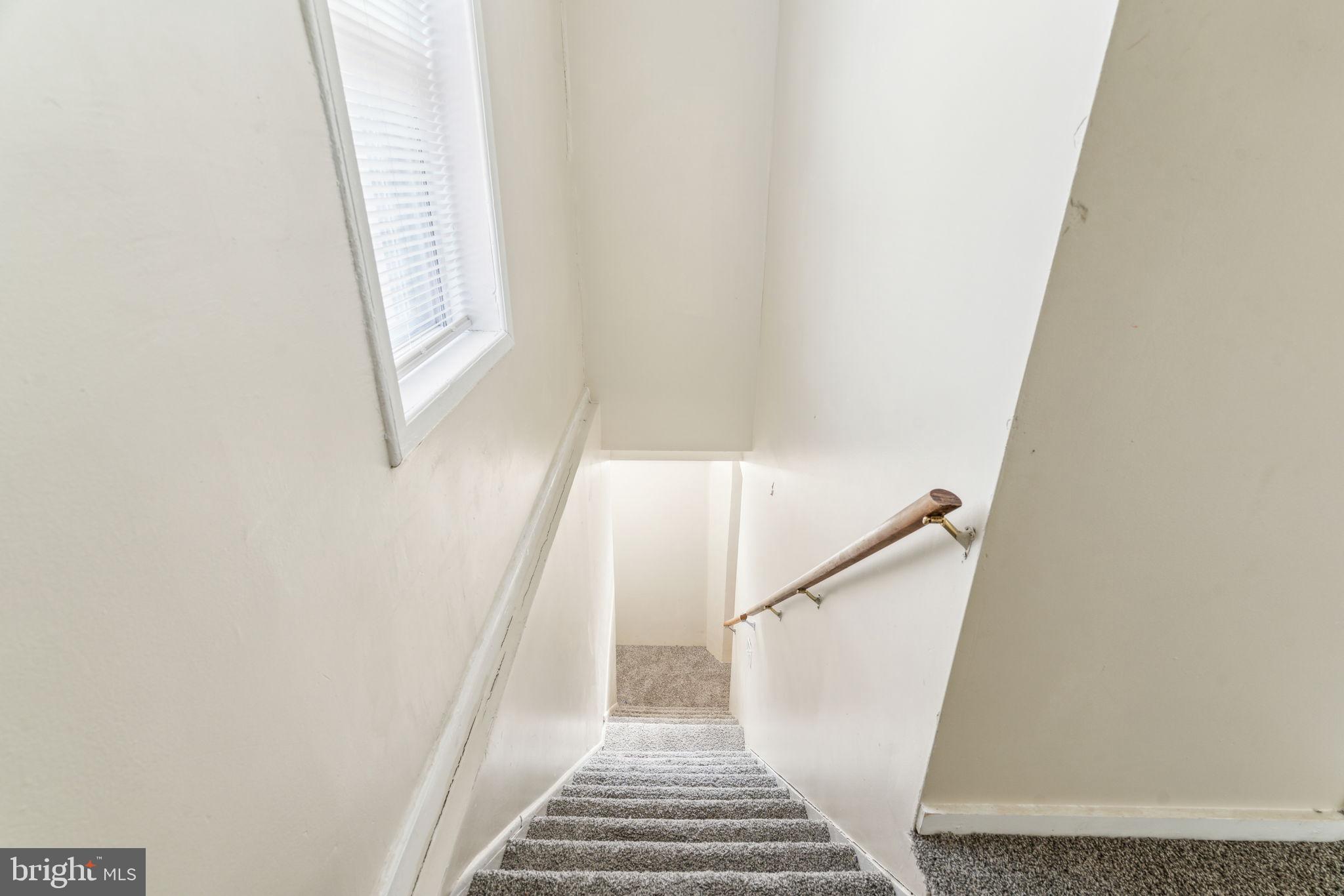 101 Pleasant Street Philadelphia, PA 19119 - Photo 36 of 43 a view of staircase with white walls and a window
