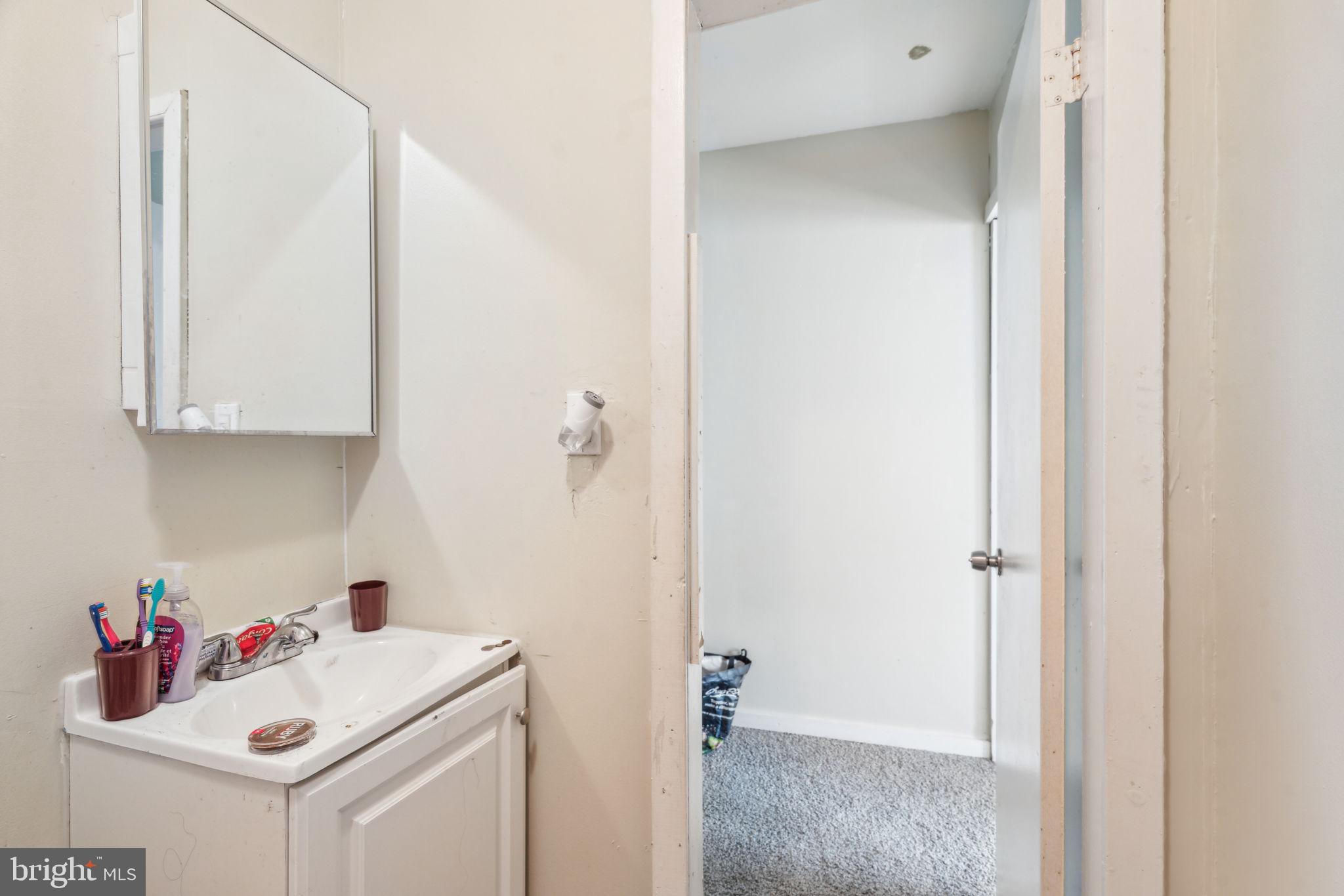 101 Pleasant Street Philadelphia, PA 19119 - Photo 40 of 43 a bathroom with a sink and a mirror