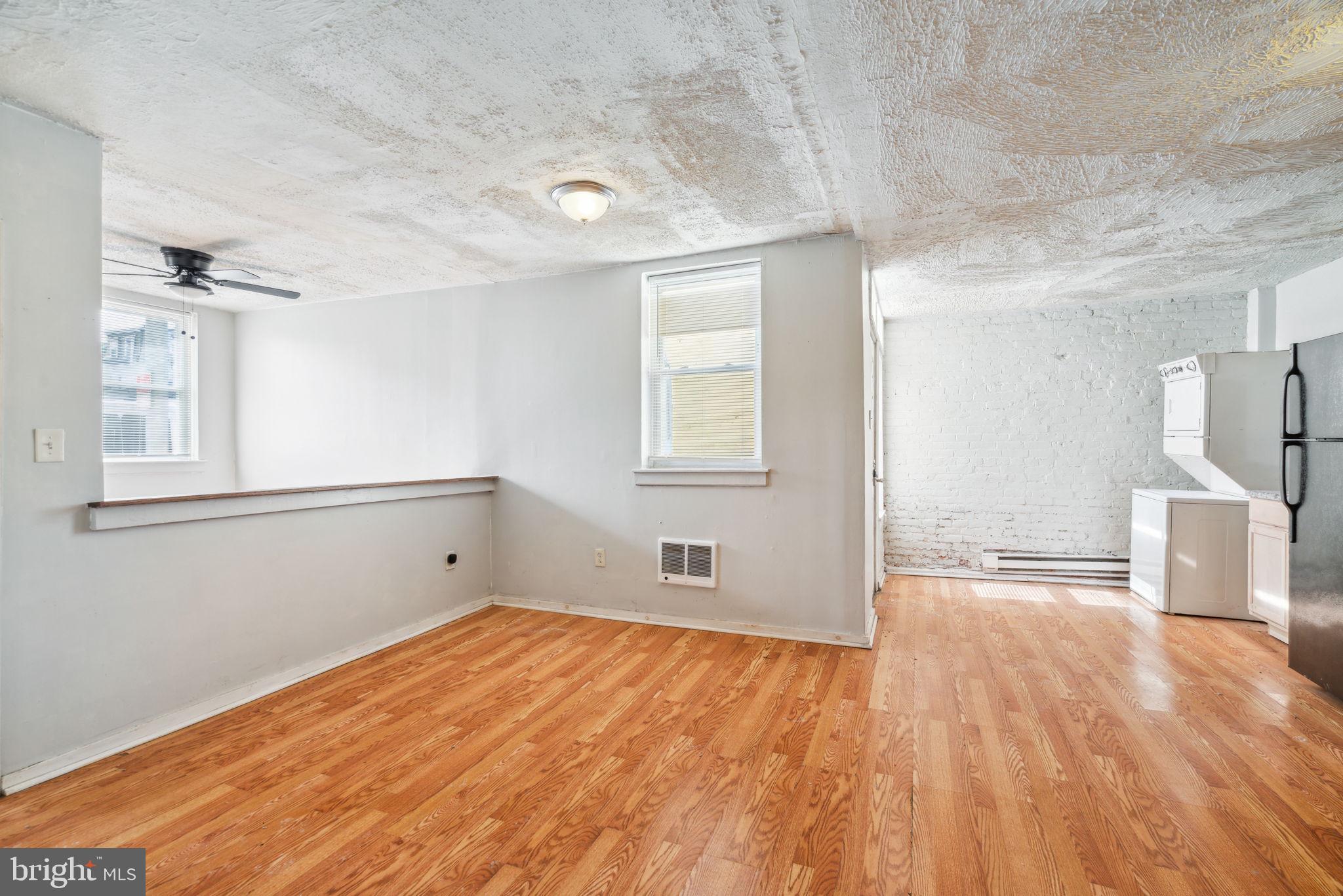 101 Pleasant Street Philadelphia, PA 19119 - Photo 9 of 43 a view of empty room with wooden floor and fan
