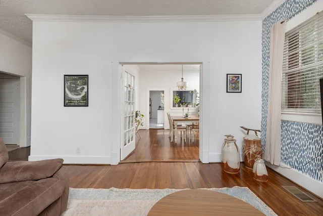 a living room with furniture and a table