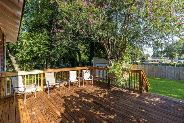 a view of a chairs and table on the wooden floor