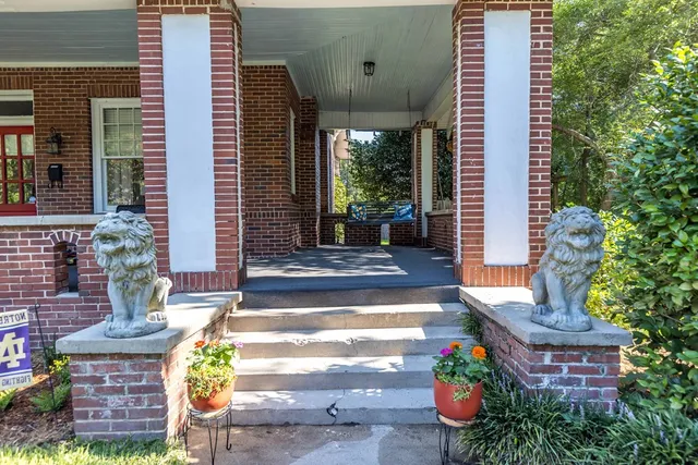 a front view of a house with outdoor seating