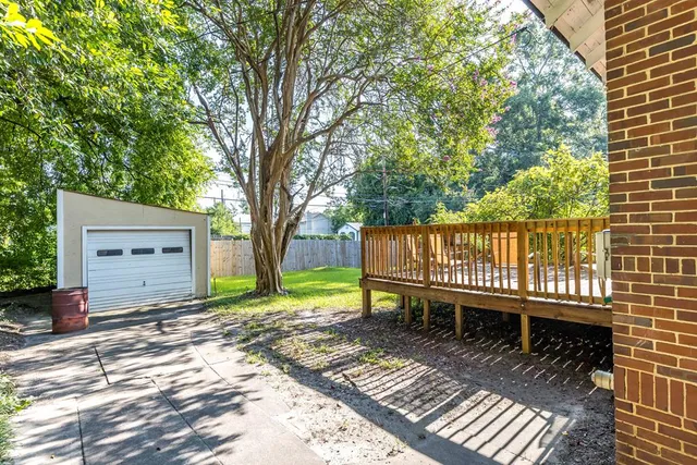 a view of a deck with a table and a chairs