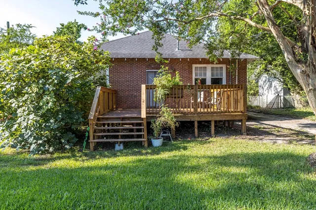 front view of a house with a garden