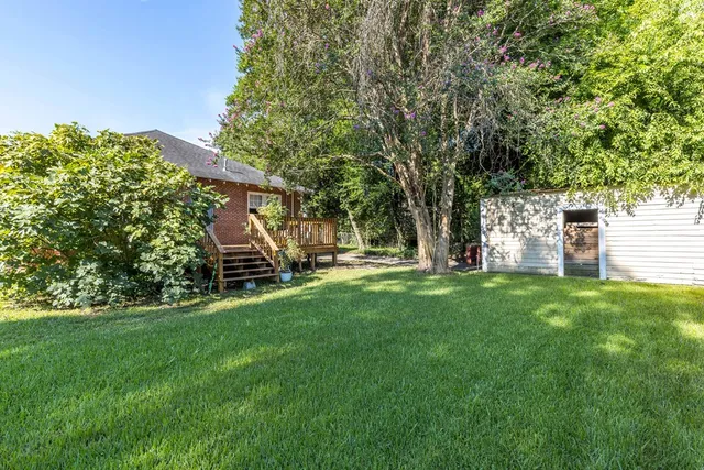 a view of backyard with green space