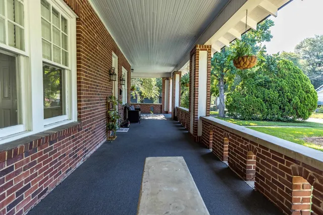 a view of a balcony with chairs