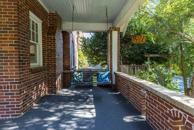 a view of a balcony with chairs