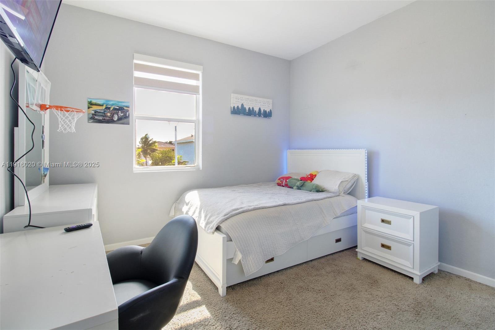 13251 Southwest 274th Terrace Homestead, FL 33032 - Photo 19 of 36 a bedroom with a bed and a couch