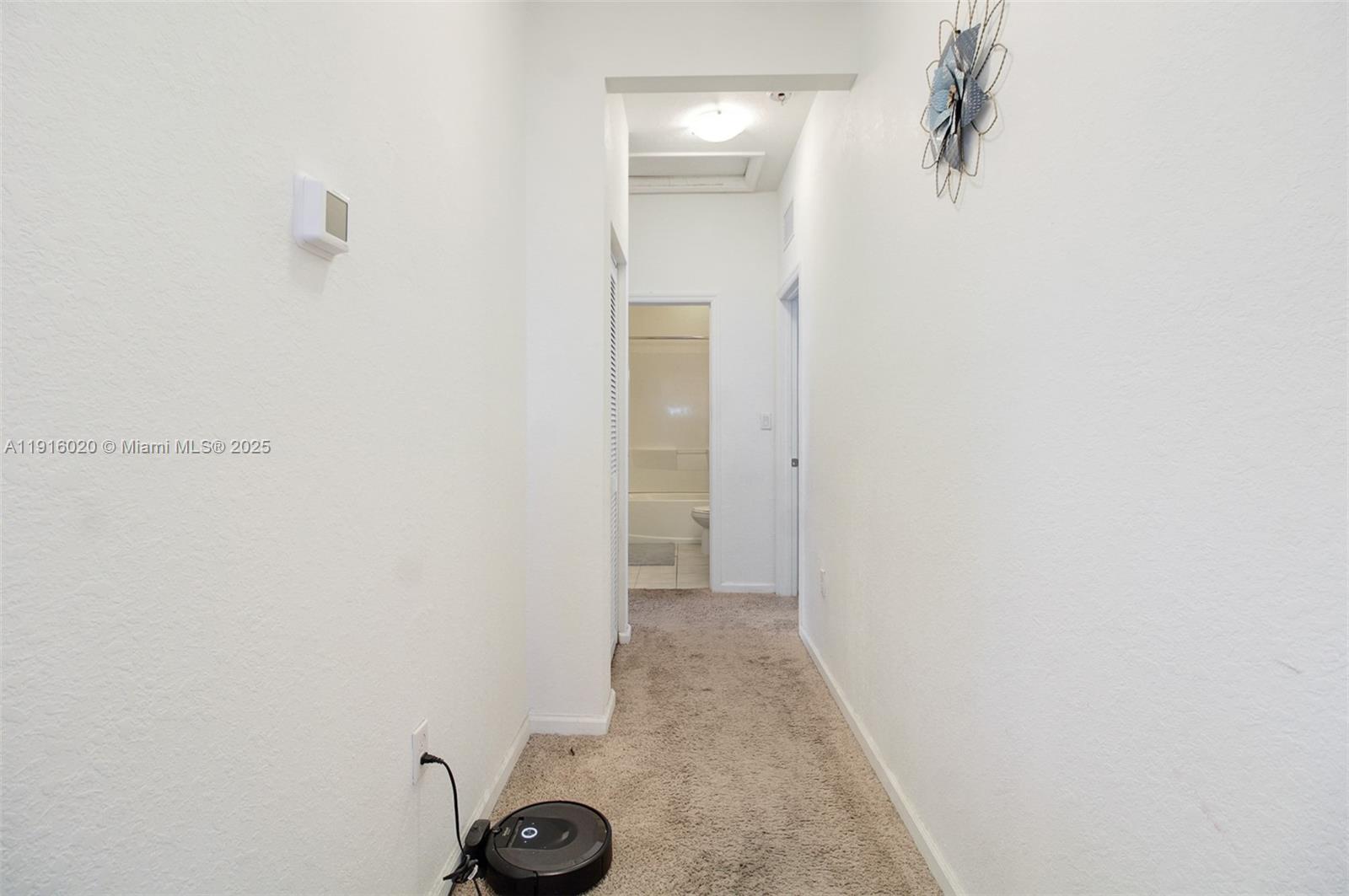 13251 Southwest 274th Terrace Homestead, FL 33032 - Photo 22 of 36 a view of a hallway with closet
