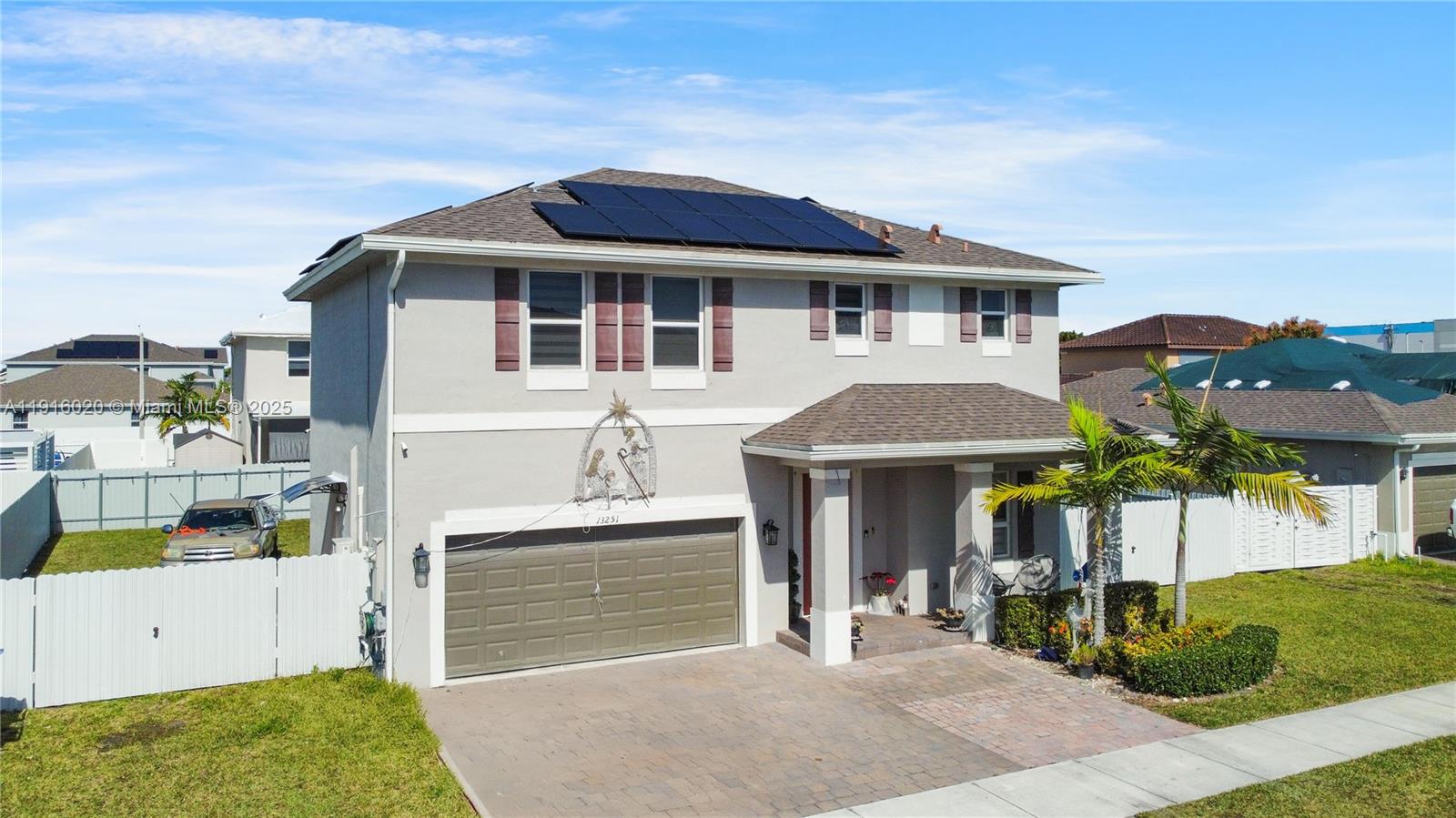 13251 Southwest 274th Terrace Homestead, FL 33032 - Photo 26 of 36 a front view of a house with garden