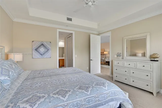 a bedroom with two beds and window