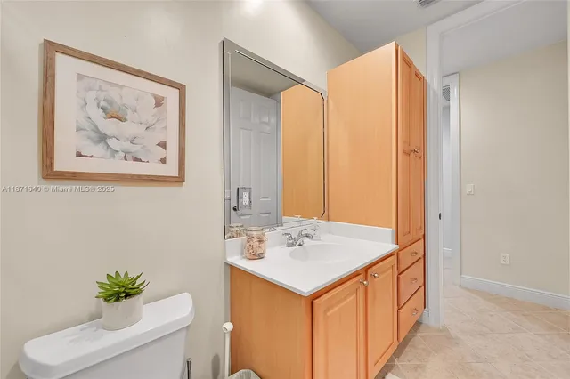 a dining room with furniture a chandelier and glass door