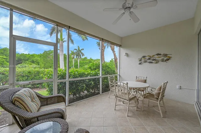 an aerial view of a house with a garden and lake view