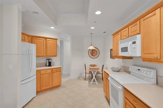 a living room with furniture a chandelier and a table